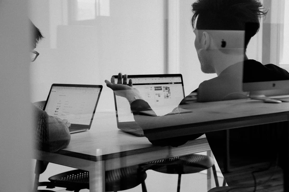 Team reviewing an AI agent workflow on a shared monitor